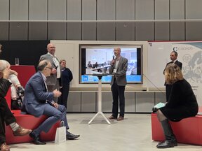 1 C-Roads Member presenting in front of an audience