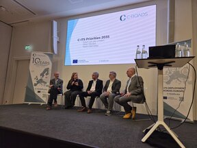 5 people on a stage doing a panel discussion